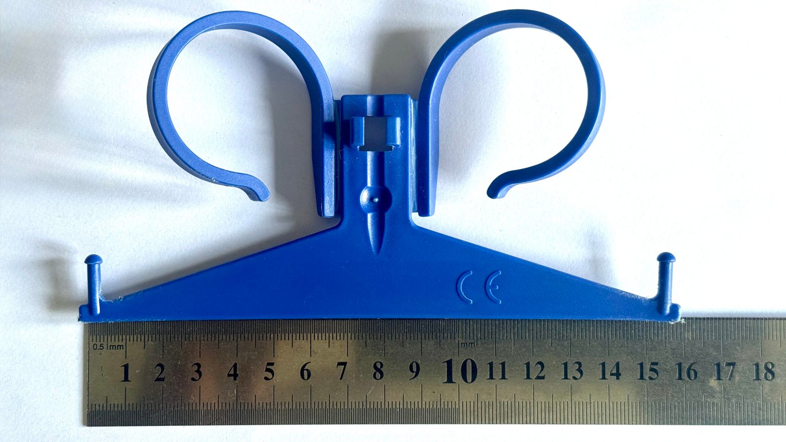 Single hook urine bag hanger shown for Uroclips compatibility checking