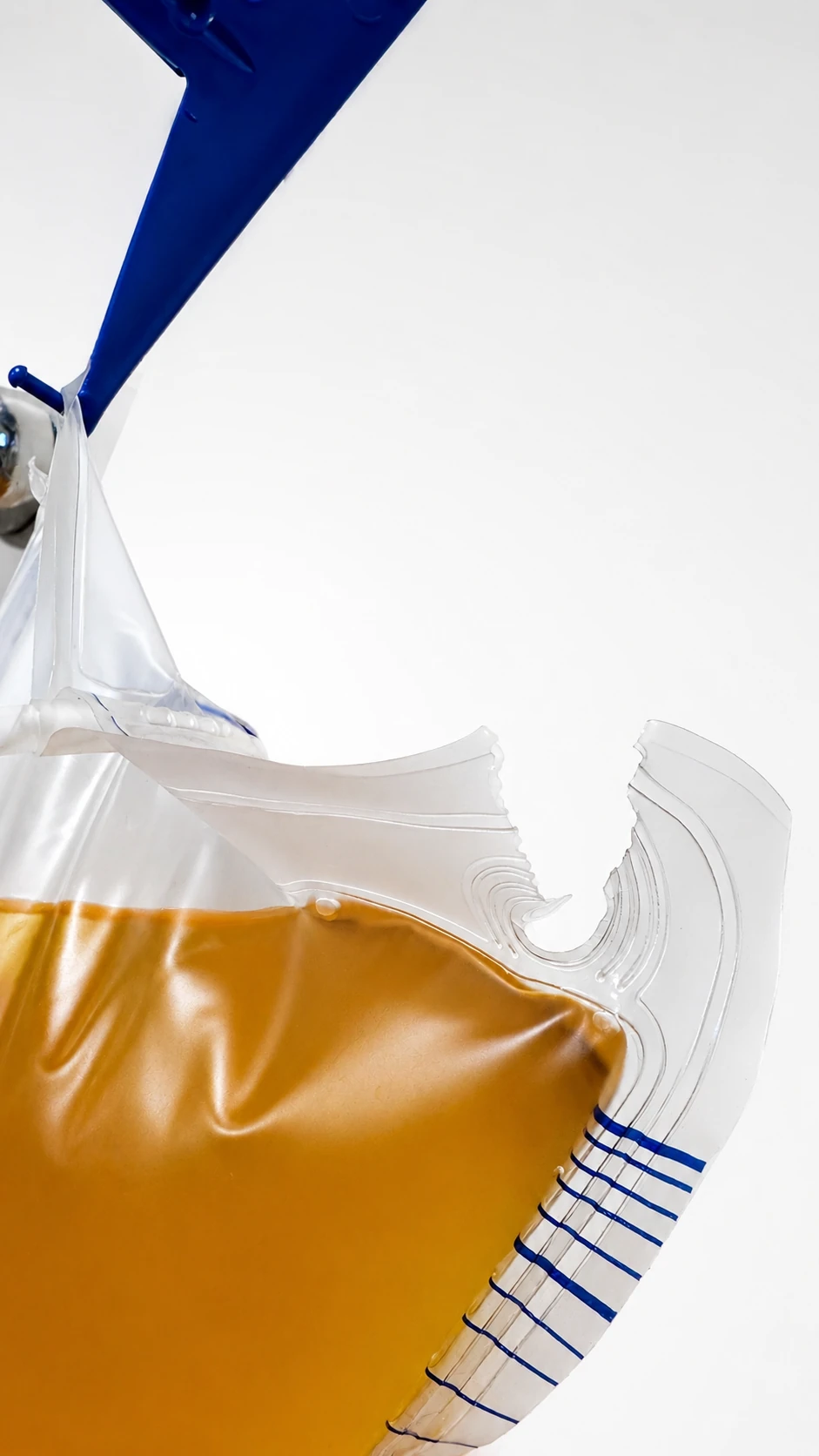 Close-up of a torn hanging hole on a urine bag